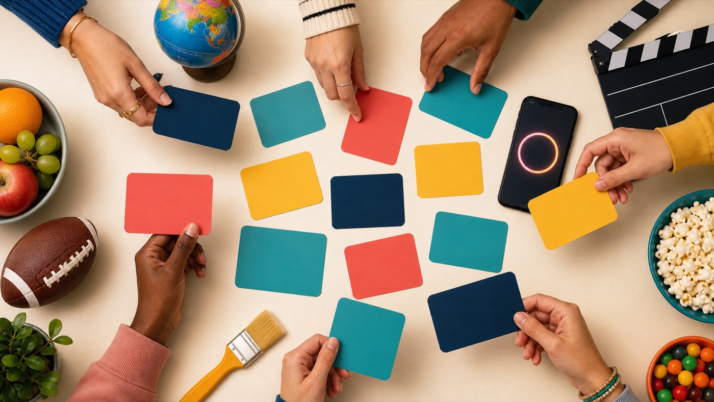 Colorful blank word cards and category objects arranged for an Alias game